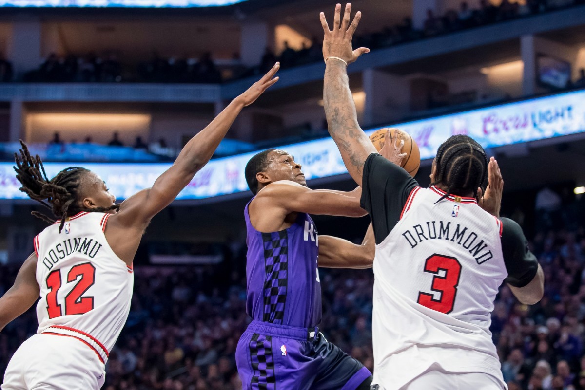 Sacramento Kings guard De'Aaron Fox (5) puts up a shot over Chicago Bulls center Andre Drummond (3) during the second quarter at Golden 1 Center. 